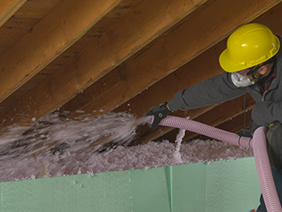 man installing insulation